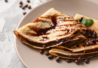 Canvas Print - Plate with delicious pancakes and chocolate sauce, closeup