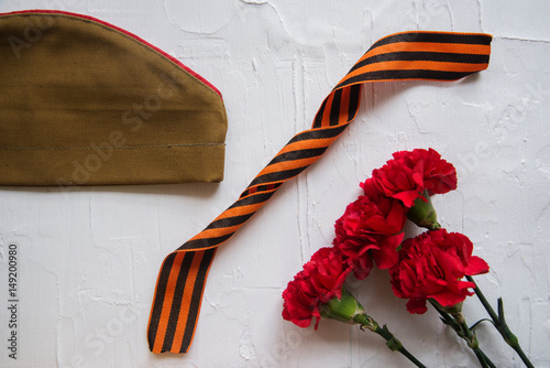 Poster Carnation, George Ribbon, military binoculars and field cap