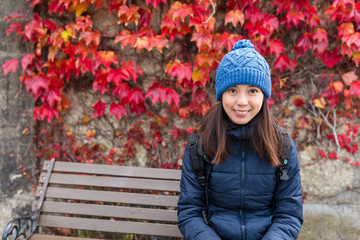 woman with autumn season maple tree