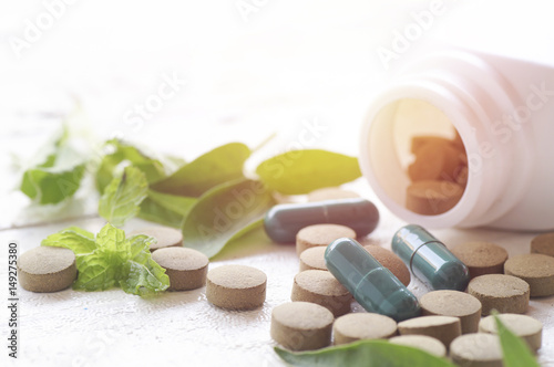 Fotografie, Obraz pill herbal on top view of wood table concept in care and healthy strong body fo