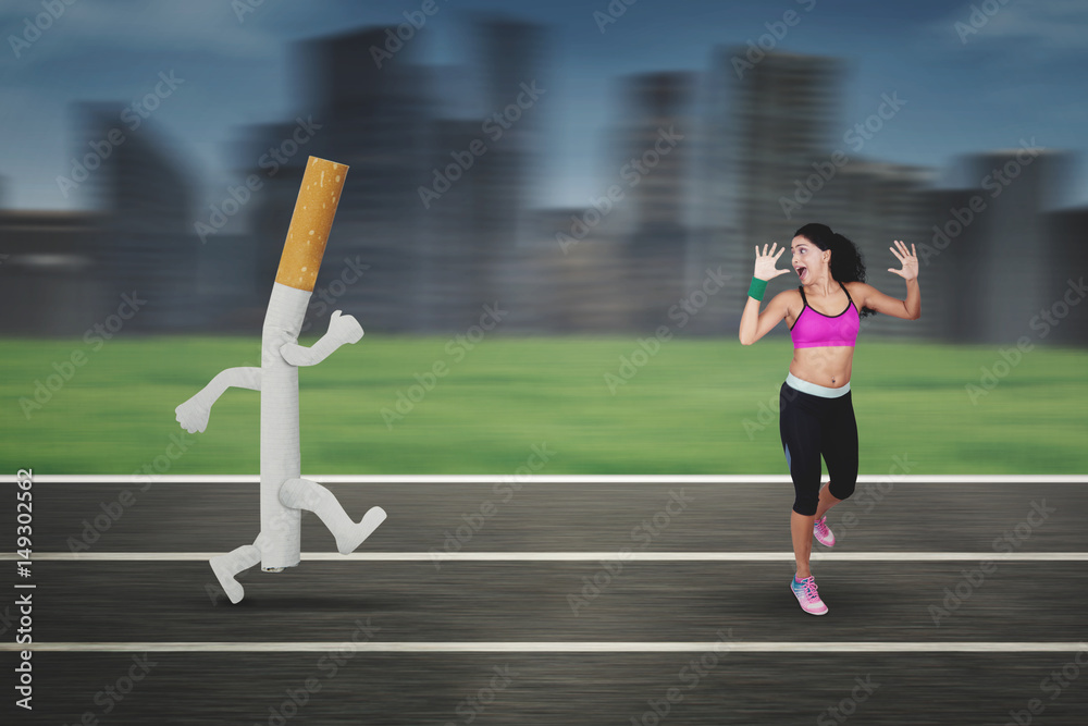 cigarettes and running Smoking Indian woman running away from