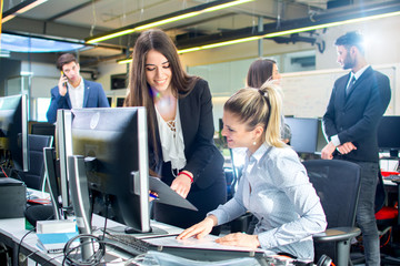 Wall Mural - Businesswomen working together in the office.