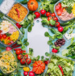 Healthy eating concept with various diet salad lunch boxes and ingredients around white cutting board, top view, frame. Clean organic  food concept