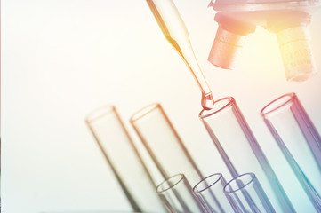 scientific experiments, laboratory equipment and test tubes- science concept