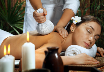 portrait of young beautiful woman in spa environment