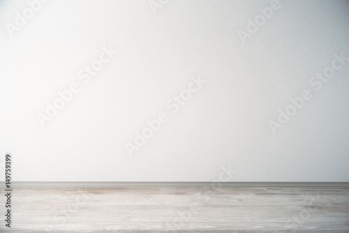Room with light wall and wooden floor
