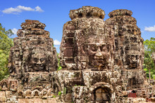 Stone Faces Of The Famous Bayon Temple In Angkor Thom Complex, Siem Reap, Cambodia.