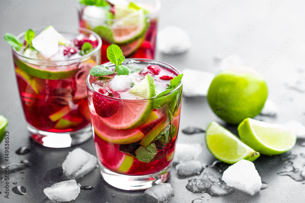 Raspberry mojito cocktail with lime, mint and ice, cold, iced refreshing drink or beverage - obrazy, fototapety, plakaty 