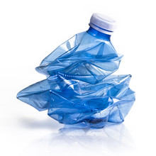 Crushed Blue Plastic Bottle On White Background. Still-life Picture Taken In Studio With Soft-box.
