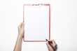 © dohee - woman hand hold a clipboard isolated white.