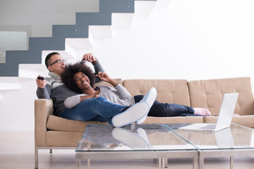 Wall Mural - multiethnic couple relaxing at home