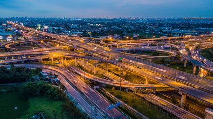 Wall Mural - Bangkok Expressway top view, Top view over the highway,expressway and motorway at night, Aerial view interchange of a city, Shot from drone, Expressway is an important infrastructure in Thailand