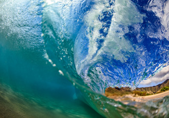 Wall Mural - sea wave closing against hawaiian beach background. shot splitted by waterline to underwater part an