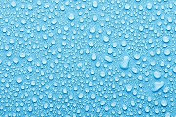 Wall Mural - Water drops on a blue background