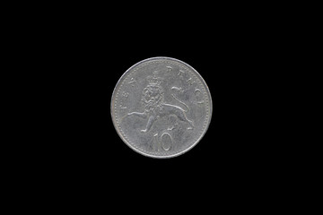 British Queen Elizabeth II 1992 Ten Pence Coin isolated on black background.