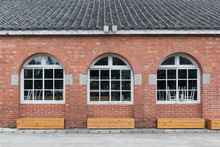 White Painted Wood With Three Red Bricks Wall Arched Windows