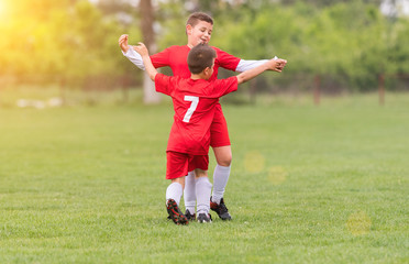 Canvas Print - Kids soccer football - children players match on soccer field