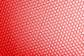 abstract texture honeycomb. Metallic net background or texture. metal mesh. full frame colourful illuminated detail of a metallic grid in front of a loudspeaker. Colorful abstract background.
