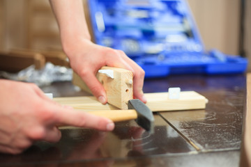 Wall Mural - Man hands constructing a chairs with some tools, woodwork