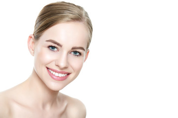 Beautiful young blond smiling woman with clean skin, natural make-up and perfect white teeth white background