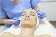 © nikodash - Beautician draw correction lines on woman face. Woman in beauty salon