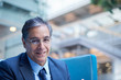 © Connect Images - Portrait of mature businessman in office atrium