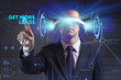 © Egor - Business, Technology, Internet and network concept. Young businessman working in virtual reality glasses sees the inscription: Get more leads