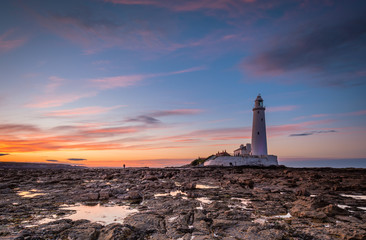 Wall Mural - dusk at st mary's lighthouse / st mary's lighthouse on a small rocky island, just north of whitley b