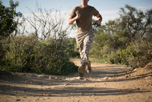 Soldier Wearing Combat Clothing Running, Runyon Canyon, Los Angeles, California, USA