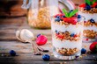 Yogurt parfait with granola,  strawberries and blueberries