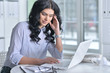 © aletia2011 - Business woman sitting at table