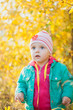 © polinabelphoto - Little girl playing with autumn leaves in the park