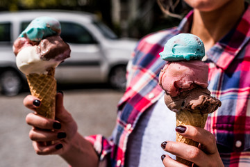 Girl Holding ice cream in the cone