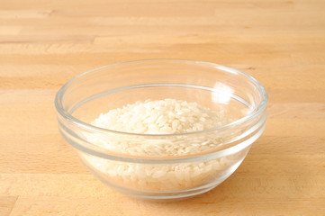 Bowl of rice on wood