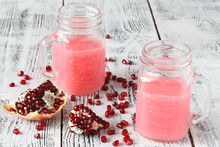 Pomegranate Smoothie In A Jar Glass With Pomegranate Pieces, Scene Rustic Wood