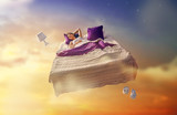 Fototapeta  - girl is flying in her bed
