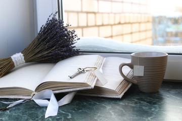 Canvas Print - Vintage notebook on green marble windowsill opened with blank pages and lavender