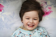 © alexkich - Portrait of a young child lying on a pillow