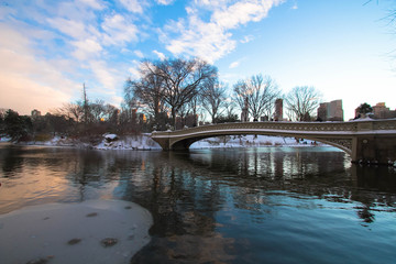 Wall Mural - Bow bridge over the lake with sunset sky, Central Park