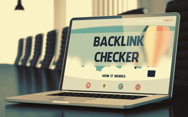 Poster - Modern Conference Room with Laptop Showing Landing Page with Text Backlink Checker. Closeup View. Blurred Image. Selective focus. 3D.