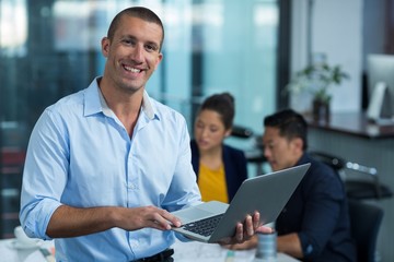 Wall Mural - Male business executive using laptop