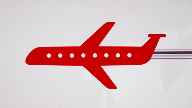 A red airplane sign