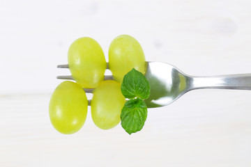 Wall Mural - white grapes on fork