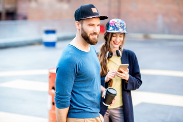 Portrait of a stylish man and woman outdoors