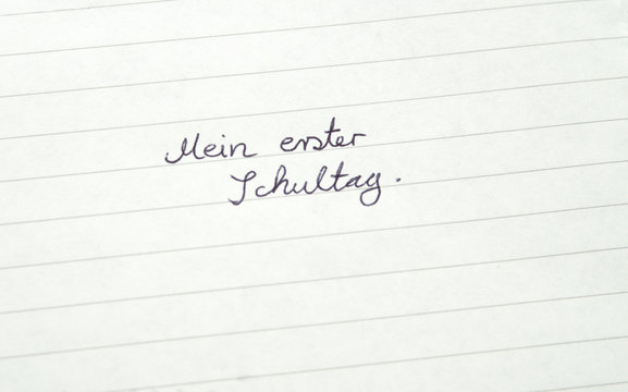 Mein erster Schultag (German: My first day at school) in handwriting on lined paper