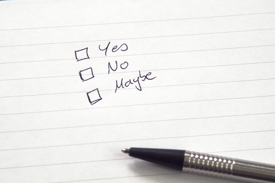Checkboxes for Yes, No, Maybe in handwriting on lined paper with pen