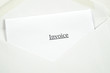 Invoice printed on white paper and envelope, white background