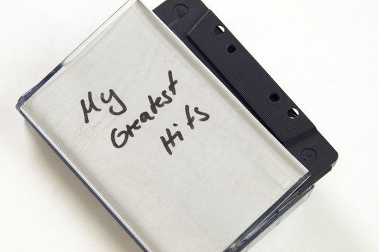 My greatest Hits in handwriting written on music cassette tape case