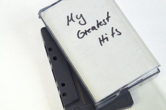 My greatest Hits in handwriting written on music cassette tape case