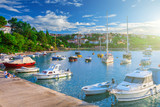 Fototapeta  - Wonderful romantic summer evening landscape panorama coastline Adriatic sea. Boats and yachts in harbor at cristal clear azure water. Old town of Krk on the island of Krk. Croatia. Europe.